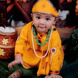 Animated GIF of a baby dressed as Krishna for a Janmashtami photoshoot.